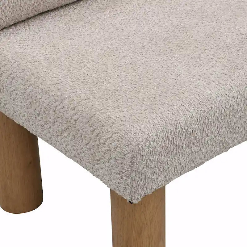 Panca da pranzo imbottita in bouclé con gambe in legno di gomma